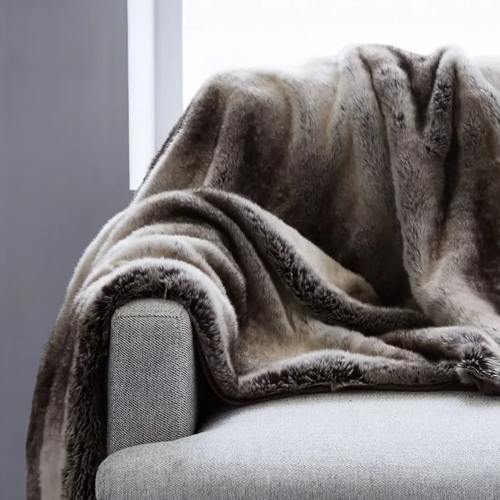Mountain Grey faux Fur Throw on a sofa