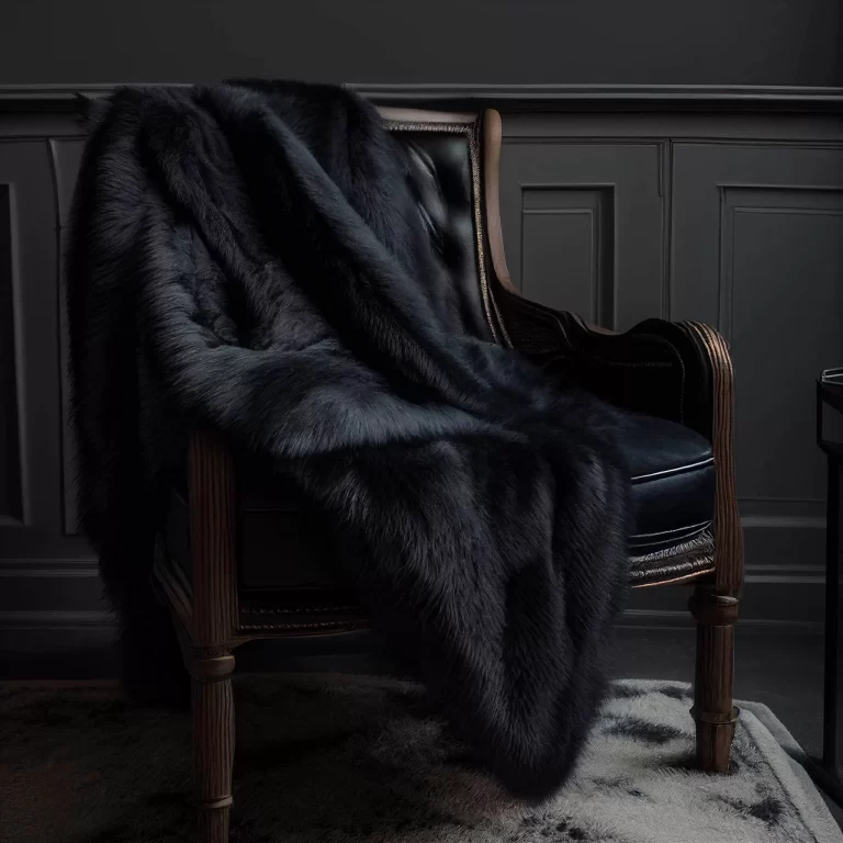 Boreal Black wolf faux fur throw on an armchair