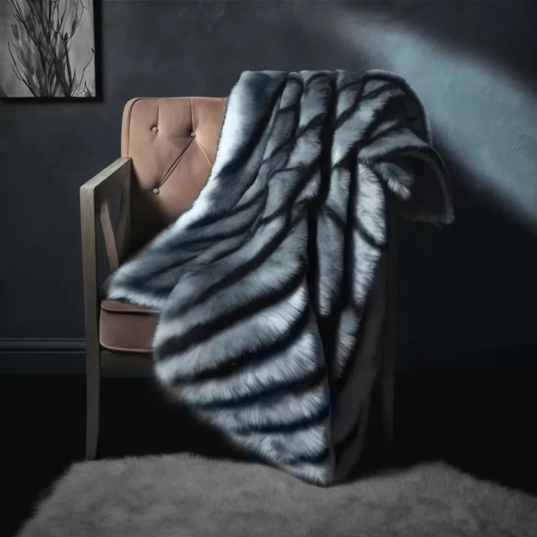 Siberian grey wolf faux fur throw on an armchair